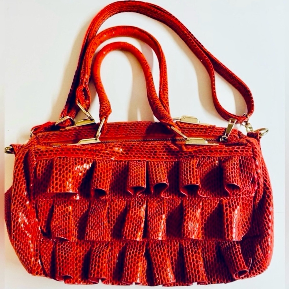 Mellow World-Red Ruffle Maximalist shoulder bag with snake print & extra strap.